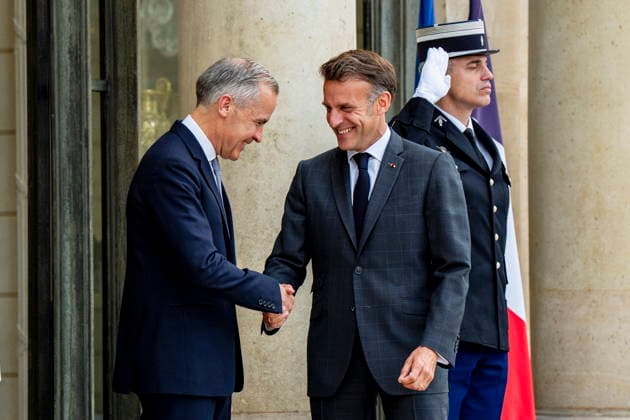 June 12, 2026, Paris, France: Canadian Prime Minister Mark Carney, left, is greeted by French President Emmanuel Macron at the Palais de löÄÃ Elysee in Paris, on Friday, June 12, 2026. Paris France  - ZUMAc35_ 20260612_zaf_c35_079 Copyright: xChristopherxKatsarovx