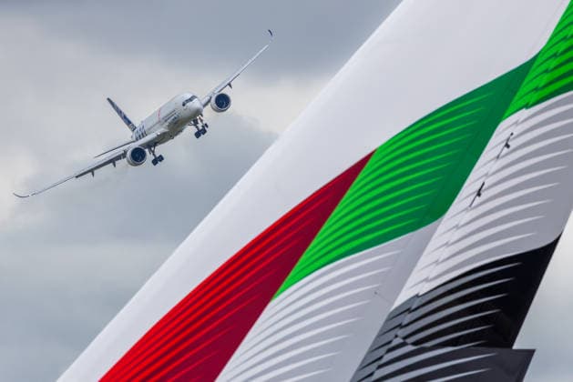 Fachbesuchertag auf ILA Berlin 2026, Berlin, 12.06.2026 Ein Airbus A350-1000 mit ANA-Lackierung im Tiefanflug, im Vordergrund das markante Leitwerk einer Emirates Airbus A380 in den Farben der Vereinigten Arabischen Emirate. Beide Maschinen sind Teil der Flugvorführungen auf der ILA 2026. Schöneberg Berlin ExpoCenter Airport Brandenburg Deutschland *** Trade visitor day at ILA Berlin 2026, Berlin, 12 06 2026 An Airbus A350 1000 with ANA livery on low approach, in the foreground the striking tail unit of an Emirates Airbus A380 in the colors of the United Arab Emirates Both aircraft are part of the flight demonstrations at ILA 2026 Schöneberg Berlin ExpoCenter Airport Brandenburg Germany 20260612-1V9A1834-M4000