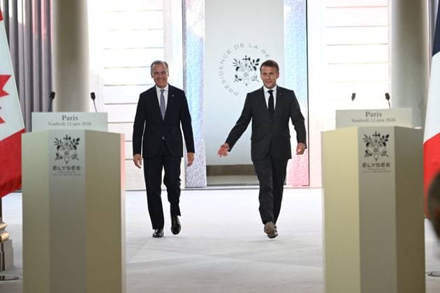 Press Conference of Emmanuel Macron and Mark Carney - Paris Canada s Prime Minister Mark Carney and France s President Emmanuel Macron arriving at a press conference ahead of a bilateral meeting at the Elysee Presidential Palace, in Paris, France on June 12, 2026. Photo by Eric Tschaen Pool ABACAPRESS.COM paris France  Copyright: xTschaenxEric Pool ABACAx