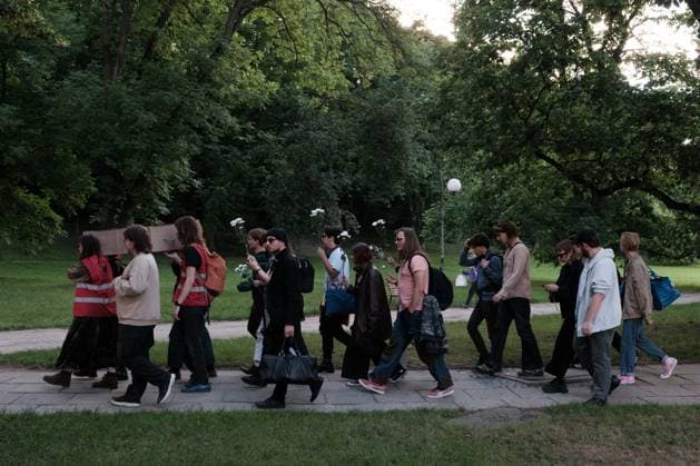 June 12, 2026, Warsaw, Masovian Voivodeship, Poland: Student activists carry a symbolic cardboard coffin and white flowers during a mock funeral procession doubling as a students demonstration welcoming the recent closure of the University of Warsaw s premium food hall, BUWBAR, located in the main library on campus. The establishment closed suddenly after only a month of operation following intense protests by students, who were promised an affordable student s canteen by the university s rector but were instead given an expensive food hall offering premium meals beyond student budgets. Warsaw Poland - ZUMAk204 20260612_zip_k204_016 Copyright: xRomanxKozielx
