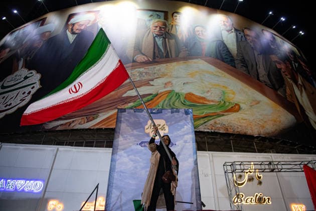 Iranians rally , waving flags in support of the government s negotiations to end the war with the United States, Anti?U.S. and anti?Israel chants echoed at Enghelab Square in Tehran late Friday, June 12, 2026.  IRN2026061210 BehnamxTofighi