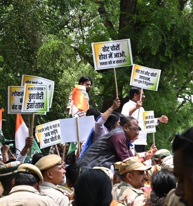 NEW DELHI, INDIA - JUNE 12: Madhya Pradesh Congress MLAs and leaders hold placards during their protest march from the AICC office to the President House against the disqualification of Congress leader Meenakshi Natarajan s nomination for the Rajya Sabha election from Madhya Pradesh on June 12, 2026 in New Delhi, India. Congress leaders alleged that by utilizing the state administrative machinery to eliminate her before the ballots are even cast, the ruling BJP establishment is attempting to force an uncontested walkover, leaving opposition lines structurally exposed. (Photo by Arvind Yadav Hindustan Times) Madhya Pradesh Congress MLAs Protest March Against Disqualification Of Rajya Sabha Candidate Meenakshi Natarajan