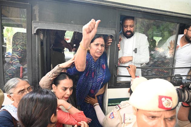 NEW DELHI, INDIA - JUNE 12: Security personnel detain Congress leaders and workers during a fierce protest at Nirvachan Sadan (Election Commission of India) against the rejection of Congress leader Meenakshi Natarajan s nomination for the Rajya Sabha election from Madhya Pradesh on June 12, 2026, in New Delhi, India.(Photo by Sonu Mehta Hindustan Times) Congress Workers Protest Outside Election Commission Against Disqualification Of Rajya Sabha Candidate Meenakshi Natarajan