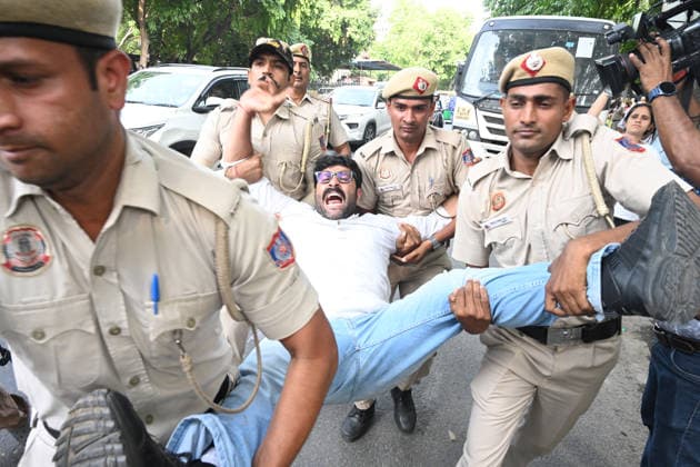 NEW DELHI, INDIA - JUNE 12: Security personnel dragged away Congress leaders and workers during a fierce protest at Nirvachan Sadan (Election Commission of India) against the rejection of Congress leader Meenakshi Natarajan s nomination for the Rajya Sabha election from Madhya Pradesh on June 12, 2026, in New Delhi, India.(Photo by Sonu Mehta Hindustan Times) Congress Workers Protest Outside Election Commission Against Disqualification Of Rajya Sabha Candidate Meenakshi Natarajan