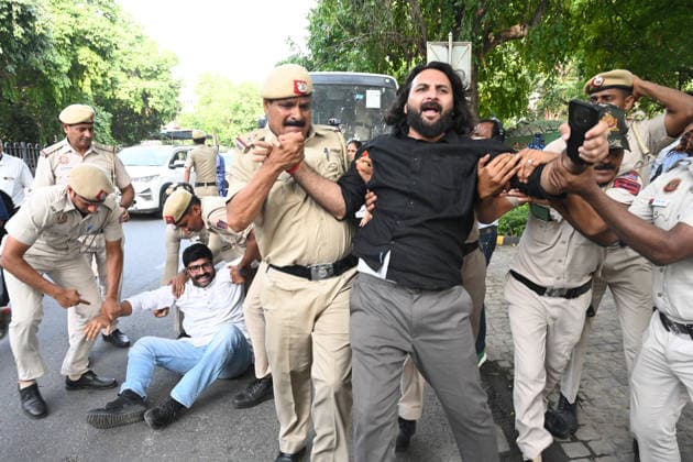 NEW DELHI, INDIA - JUNE 12: Security personnel dragged away Congress leaders and workers during a fierce protest at Nirvachan Sadan (Election Commission of India) against the rejection of Congress leader Meenakshi Natarajan s nomination for the Rajya Sabha election from Madhya Pradesh on June 12, 2026, in New Delhi, India.(Photo by Sonu Mehta Hindustan Times) Congress Workers Protest Outside Election Commission Against Disqualification Of Rajya Sabha Candidate Meenakshi Natarajan