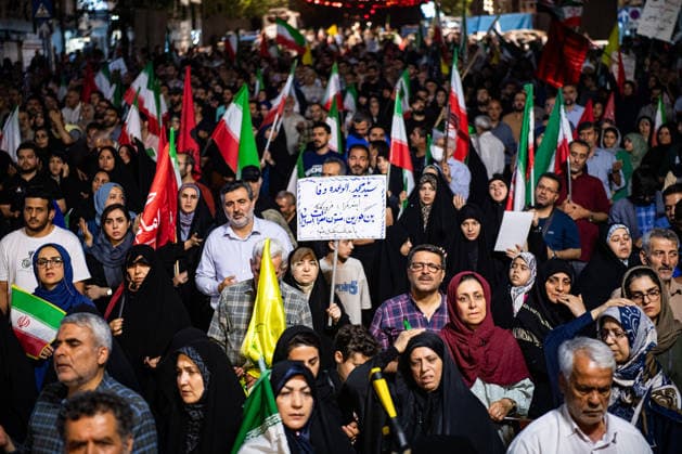 Iranians rally , waving flags in support of the government s negotiations to end the war with the United States, Anti?U.S. and anti?Israel chants echoed at Enghelab Square in Tehran late Friday, June 12, 2026.  IRN2026061216 BehnamxTofighi