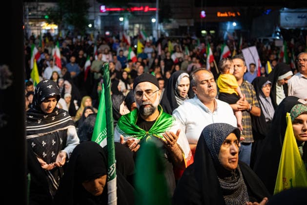 Iranians rally , waving flags in support of the government s negotiations to end the war with the United States, Anti?U.S. and anti?Israel chants echoed at Enghelab Square in Tehran late Friday, June 12, 2026.  IRN2026061217 BehnamxTofighi