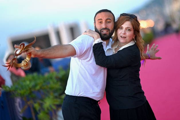 40th Cabourg Film Festival Day 3 FC Oussama Kheddam and Agnes Jaoui pose with his award on the red carpet during Day Three of the 40th Cabourg Film Festival on June 12, 2026 in Cabourg, France.. Photo by Franck Castel ABACAPRESS.COM Cabourg  Copyright: xCastelxFranck ABACAx