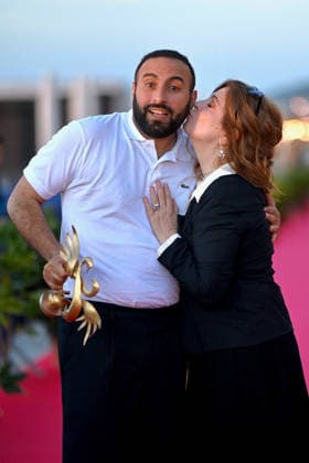 40th Cabourg Film Festival Day 3 FC Oussama Kheddam and Agnes Jaoui pose with his award on the red carpet during Day Three of the 40th Cabourg Film Festival on June 12, 2026 in Cabourg, France.. Photo by Franck Castel ABACAPRESS.COM Cabourg  Copyright: xCastelxFranck ABACAx