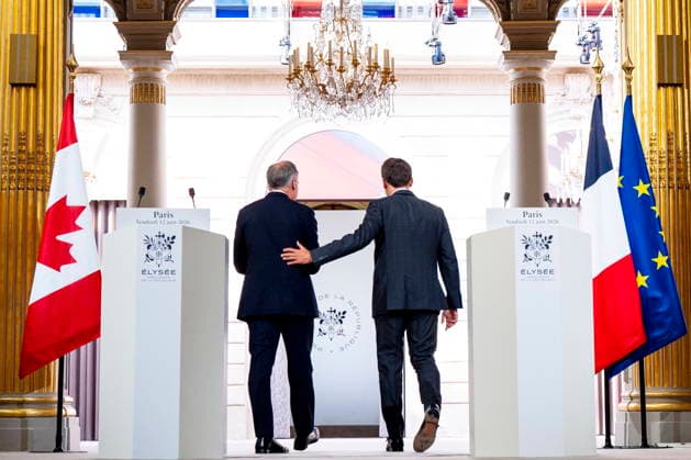 June 12, 2026, Paris, France: Prime Minister Mark Carney, left, and French President Emmanuel Macron exit after delivering remarks at the Palais de löÄÃ Elysee in Paris on Friday, June 12, 2026. Paris France  - ZUMAc35_ 20260612_zaf_c35_313 Copyright: xChristopherxKatsarovx