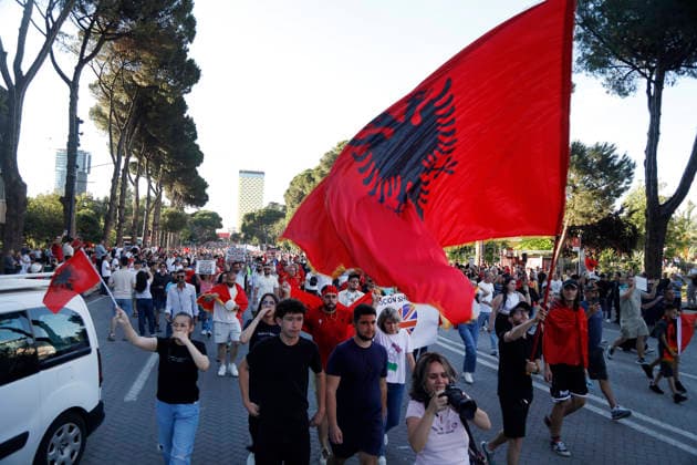 Protest against the construction of a luxury resort in Tirana, Albania. Protesters hold signs and Albanian national flags as they take part in a demonstration in front of the prime minister s office in Tirana on June 12, 2026, opposing the construction of a luxury resort in a protected natural area near the city of Vlore. Several thousand citizens demonstrated in Tirana for the 13th consecutive night to demand transparency on a luxury tourism complex project in the protected area of Narta Lagoon in the city of Vlore linked to US President Donald Trump s son-in-law Jared Kushner and his wife, Ivanka Trump. The project was planned for two areas along the Adriatic coast, the protected delta area of Vjosa-Narta and the nearby uninhabited island Copyright: xLightxStudioxAgencyx xMaltonxDibrax