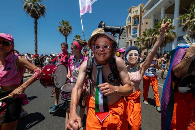 LGBT Pride clebration in Tel Aviv, Israel - 12 Jun 2026 Protesters dress up as politicians in a satirical way, portraying them as if they were supporters of the LGBTQ+ community, despite their public statements against it. The Pride Parade in Tel Aviv, Israel, took place after a three-year hiatus due to the war. This year as well, the war remained a backdrop to the event, as Tel Aviv had been targeted by Iranian missile attacks just a few days earlier. Despite these challenges, thousands of people across Israel came out to celebrate love, pride, and equality, marching in support of equal rights for the LGBTQ+ community, including gay men and lesbians. Tel Aviv Israel Copyright: xYaelxGuiskyxAbasx xSOPAxImagesx _DSC7194s