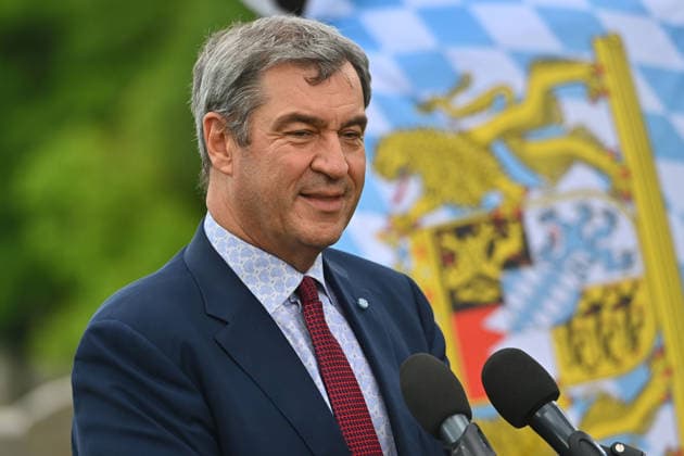 Markus SOEDER (Ministerpraesident Bayern und CSU Vorsitzender) vor bayerischer Flagge,Fahne. Einzelbild,angeschnittenes Einzelmotiv,Portraet,Portrait,Porträt. Einweihung des neuen Ludwig II.-Denkmals auf der Bastion der Corneliusbruecke am 13.06.2026 in Muenchen. *** Markus SOEDER State Premier of Bavaria and CSU Chairman in front of Bavarian flag,flag single image,cropped single motif,portrait,portrait,portrait inauguration of the new Ludwig II monument on the bastion of the Cornelius Bridge on 13 06 2026 in Munich
