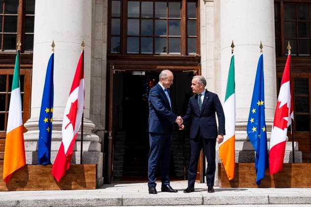 June 13, 2026, Dublin, Ireland: Prime Minister Mark Carney is greeted by Micheal Martin, Ireland s head of government, left, at the Government Buildings in Dublin, on Saturday, June 13, 2026. Dublin Ireland  - ZUMAc35_ 20260613_zaf_c35_014 Copyright: xChristopherxKatsarovx
