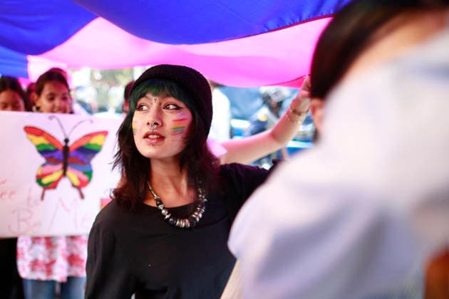 June 13, 2026, Kathmandu, Nepal: A woman holds a placard with a butterfly in rainbow colors during a Pride Parade celebrating the LGBTIQA+ community. Kathmandu Nepal - ZUMAs197 20260613_aaa_s197_039 Copyright: xSkandaxGautamx