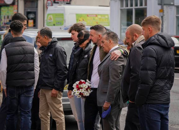 June 13, 2026, Nottingham, East Midlands, UK: Nottingham, UK. Dr Sanjoy Kumar (grey suit) The father of Grace O Malley Kumar, and Lee Coates (holding flowers), the son of Ian Coates, gather on Ilkeston Road in Nottingham. Today marks the third anniversary after Valdo Calocane murdered Barnaby Webber, Grace OÃ¢â‚¬â ¢Malley-Kumar and Ian Coates in Nottingham on 13 June 2026. Nottingham UK  - ZUMAl94_ 20260613_zaf_l94_077 Copyright: xIoannisxAlexopoulosx