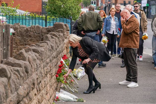 June 13, 2026, Nottingham, East Midlands, UK: Nottingham, UK. Wayne Birkett (R), Survivor of the Nottingham attack, reacts as his wife lays flowers on Ilkeston Road in Nottingham. Today marks the third anniversary after Valdo Calocane murdered Barnaby Webber, Grace OÃ¢â‚¬â ¢Malley-Kumar and Ian Coates in Nottingham on 13 June 2026. Nottingham UK  - ZUMAl94_ 20260613_zaf_l94_079 Copyright: xIoannisxAlexopoulosx