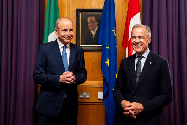 June 13, 2026, Dublin, Ireland: Prime Minister Mark Carney, right, poses for a photograph with Micheal Martin, Ireland s head of government, in front of a portrait of Harry Boland, at the Government Buildings in Dublin, on Saturday, June 13, 2026. Dublin Ireland  - ZUMAc35_ 20260613_zaf_c35_022 Copyright: xChristopherxKatsarovx