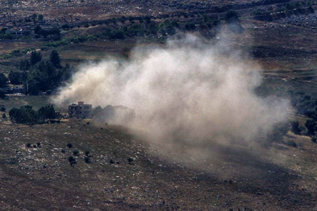 June 13, 2026, Kfar Tebniet, Kfar Tebniet, Lebanon: Smoke from a explosion conducted by Israeli forces engulfs houses in the southern Lebanese village of Kfar Tebniet. The Lebanese army withdrew its troops from a base Kfar Tebniet after Israeli troops advanced in an area nearby, a military official said. The army departure came as the Israeli military issued an evacuation warning for about 20 locations, including the southern city of Nabatieh and nearby villages. Kfar Tebniet Lebanon - ZUMAn313 20260613_zip_n313_004 Copyright: xMarwanxNaamanix