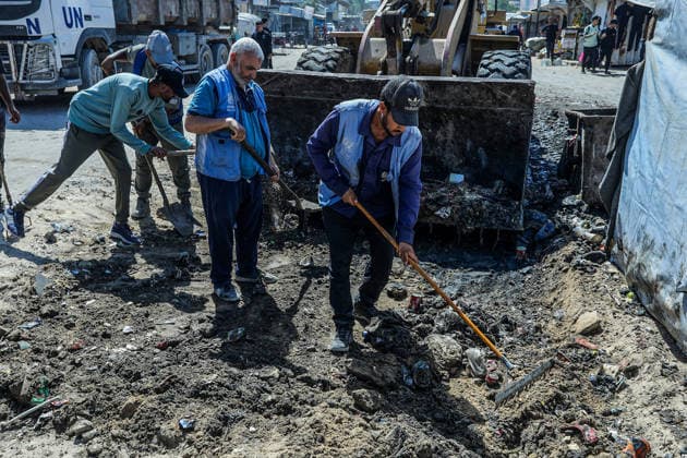 Teams affiliated with UNRWA carry out cleaning operations in Khan Yunis KHAN YUNIS, GAZA, PALESTINE - JUNE 13: Teams from the United Nations Relief and Works Agency for Palestine Refugees in the Near East (UNRWA) use heavy machinery to remove garbage piled up on the streets of Khan Yunis, Gaza, Palestine, on June 13, 2026. Waste has been accumulating on streets and near residential areas due to severe damage to infrastructure caused by attacks, insufficient municipal vehicles. Abed Rahim Khatib Anadolu Khan Yunis Gaza. Editorial use only. Please get in touch for any other usage.  Copyright: x2026xAnadoluxAbedxRahimxKhatibx
