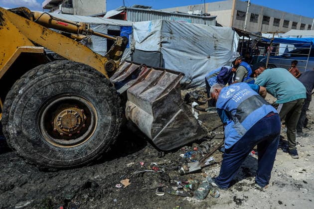 Teams affiliated with UNRWA carry out cleaning operations in Khan Yunis KHAN YUNIS, GAZA, PALESTINE - JUNE 13: Teams from the United Nations Relief and Works Agency for Palestine Refugees in the Near East (UNRWA) use heavy machinery to remove garbage piled up on the streets of Khan Yunis, Gaza, Palestine, on June 13, 2026. Waste has been accumulating on streets and near residential areas due to severe damage to infrastructure caused by attacks, insufficient municipal vehicles. Abed Rahim Khatib Anadolu Khan Yunis Gaza. Editorial use only. Please get in touch for any other usage.  Copyright: x2026xAnadoluxAbedxRahimxKhatibx
