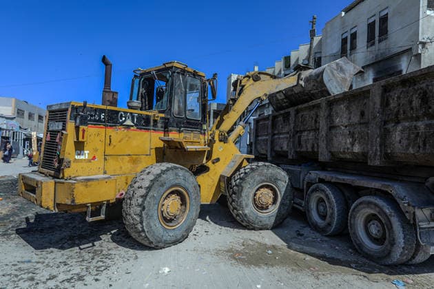 Teams affiliated with UNRWA carry out cleaning operations in Khan Yunis KHAN YUNIS, GAZA, PALESTINE - JUNE 13: Teams from the United Nations Relief and Works Agency for Palestine Refugees in the Near East (UNRWA) use heavy machinery to remove garbage piled up on the streets of Khan Yunis, Gaza, Palestine, on June 13, 2026. Waste has been accumulating on streets and near residential areas due to severe damage to infrastructure caused by attacks, insufficient municipal vehicles. Abed Rahim Khatib Anadolu Khan Yunis Gaza. Editorial use only. Please get in touch for any other usage.  Copyright: x2026xAnadoluxAbedxRahimxKhatibx