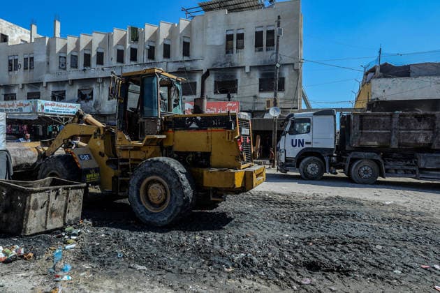 Teams affiliated with UNRWA carry out cleaning operations in Khan Yunis KHAN YUNIS, GAZA, PALESTINE - JUNE 13: Teams from the United Nations Relief and Works Agency for Palestine Refugees in the Near East (UNRWA) use heavy machinery to remove garbage piled up on the streets of Khan Yunis, Gaza, Palestine, on June 13, 2026. Waste has been accumulating on streets and near residential areas due to severe damage to infrastructure caused by attacks, insufficient municipal vehicles. Abed Rahim Khatib Anadolu Khan Yunis Gaza. Editorial use only. Please get in touch for any other usage.  Copyright: x2026xAnadoluxAbedxRahimxKhatibx