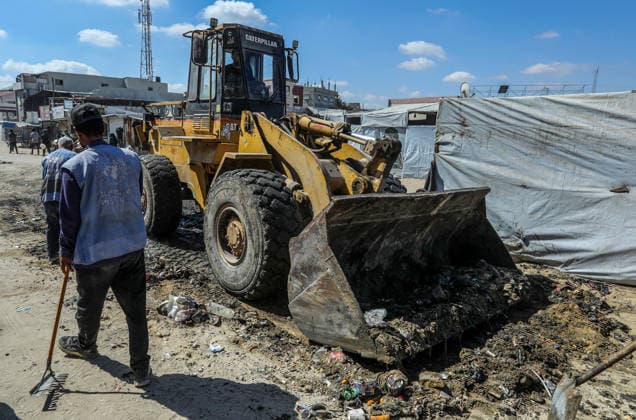 Teams affiliated with UNRWA carry out cleaning operations in Khan Yunis KHAN YUNIS, GAZA, PALESTINE - JUNE 13: Teams from the United Nations Relief and Works Agency for Palestine Refugees in the Near East (UNRWA) use heavy machinery to remove garbage piled up on the streets of Khan Yunis, Gaza, Palestine, on June 13, 2026. Waste has been accumulating on streets and near residential areas due to severe damage to infrastructure caused by attacks, insufficient municipal vehicles. Abed Rahim Khatib Anadolu Khan Yunis Gaza. Editorial use only. Please get in touch for any other usage.  Copyright: x2026xAnadoluxAbedxRahimxKhatibx