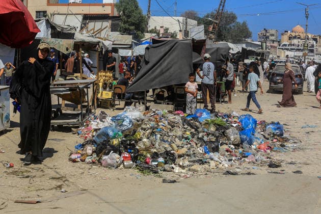 Teams affiliated with UNRWA carry out cleaning operations in Khan Yunis KHAN YUNIS, GAZA, PALESTINE - JUNE 13: A view of accumulated garbage as teams from the United Nations Relief and Works Agency for Palestine Refugees in the Near East (UNRWA) use heavy machinery to remove garbage piled up on the streets of Khan Yunis, Gaza, Palestine, on June 13, 2026. Waste has been accumulating on streets and near residential areas due to severe damage to infrastructure caused by attacks, insufficient municipal vehicles. Abed Rahim Khatib Anadolu Khan Yunis Gaza. Editorial use only. Please get in touch for any other usage.  Copyright: x2026xAnadoluxAbedxRahimxKhatibx
