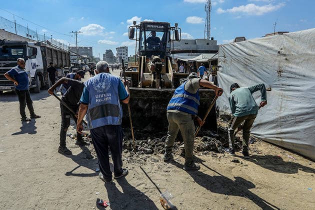 Teams affiliated with UNRWA carry out cleaning operations in Khan Yunis KHAN YUNIS, GAZA, PALESTINE - JUNE 13: Teams from the United Nations Relief and Works Agency for Palestine Refugees in the Near East (UNRWA) use heavy machinery to remove garbage piled up on the streets of Khan Yunis, Gaza, Palestine, on June 13, 2026. Waste has been accumulating on streets and near residential areas due to severe damage to infrastructure caused by attacks, insufficient municipal vehicles. Abed Rahim Khatib Anadolu Khan Yunis Gaza. Editorial use only. Please get in touch for any other usage.  Copyright: x2026xAnadoluxAbedxRahimxKhatibx