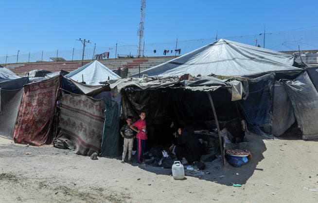 Khan Yunis Stadium in Gaza has become a shelter for displaced Palestinians KHAN YUNIS, GAZA, PALESTINE - JUNE 13: People are seen among makeshift tents as Khan Yunis Stadium which hosts Palestinian league matches, has been turned into a shelter for displaced Palestinians despite losing its former condition due to the strikes, has now become an area filled with tents of families who have lost their homes. Abed Rahim Khatib Anadolu Khan Yunis Gaza. Editorial use only. Please get in touch for any other usage.  Copyright: x2026xAnadoluxAbedxRahimxKhatibx