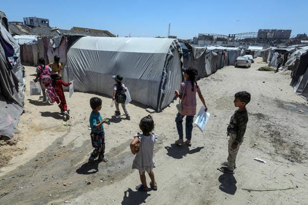 Khan Yunis Stadium in Gaza has become a shelter for displaced Palestinians KHAN YUNIS, GAZA, PALESTINE - JUNE 13: Children are seen among makeshift tents as Khan Yunis Stadium which hosts Palestinian league matches, has been turned into a shelter for displaced Palestinians despite losing its former condition due to the strikes, has now become an area filled with tents of families who have lost their homes. Abed Rahim Khatib Anadolu Khan Yunis Gaza. Editorial use only. Please get in touch for any other usage.  Copyright: x2026xAnadoluxAbedxRahimxKhatibx