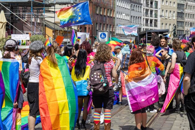 Augsburg, Bavaria, Germany June 13, 2026: Participants carrying rainbow flags and wearing colorful costumes take part in Christopher Street Day (CSD) in Augsburg. The parade through the city center promotes the rights of LGBTQ+ people as well as social diversity and tolerance. Several participants carry various Pride and identity flags *** Teilnehmerinnen und Teilnehmer mit Regenbogenflaggen und bunten Kostümen nehmen am Christopher Street Day (CSD) in Augsburg teil. Der Demonstrationszug durch die Innenstadt wirbt für die Rechte von LGBTQ+-Menschen sowie für gesellschaftliche Vielfalt und Toleranz. Mehrere Teilnehmerinnen und Teilnehmer tragen unterschiedliche Pride- und Identitätsflaggen