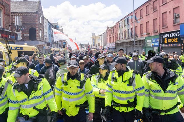 Anti-immigration protest march, Walton, Liverpool, UK, 13 June 2026. A large police presence prevents major disorder at an anti-immigration, pro-deportation protest march in Walton, Liverpool, UK, 13 June 2026., Credit:John Johnson Avalon  Copyright: xJohnxJohnsonx xAvalonx 1109948390