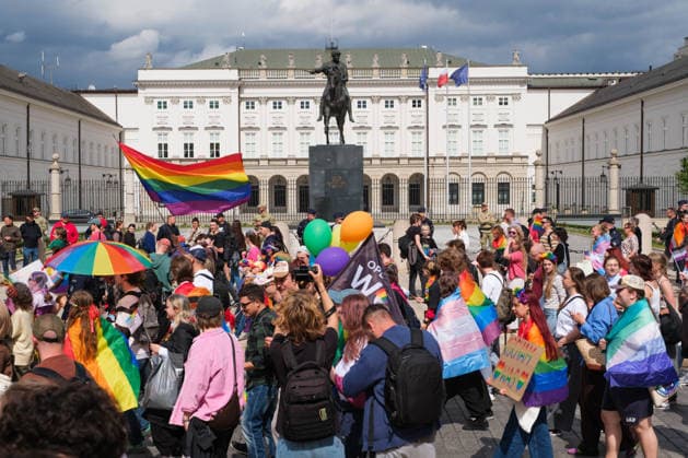 June 13, 2026, Warsaw, Masovian Voivodeship, Poland: People with rainbow pride flags march in front of the Presidential Palace during the 25th annual Warsaw LGBTQ+ Pride Parade, known in Polish as the Equality Parade. LGBTQ+ people in Poland do not have the right to same-sex civil partnerships, marriage, and child adoption, while also facing homophobia and queerphobia from a largely conservative society. Therefore, the parade is organized primarily as a march for equal rights. Warsaw Poland  - ZUMAk204 20260613_zip_k204_018 Copyright: xRomanxKozielx