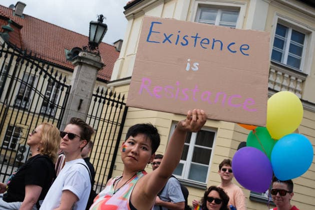 June 13, 2026, Warsaw, Masovian Voivodeship, Poland: A person holds up a sign that reads existence is resistance during the 25th annual Warsaw LGBTQ+ Pride Parade, known in Polish as the Equality Parade. LGBTQ+ people in Poland do not have the right to same-sex civil partnerships, marriage, and child adoption, while also facing homophobia and queerphobia from a largely conservative society. Therefore, the parade is organized primarily as a march for equal rights. Warsaw Poland  - ZUMAk204 20260613_zip_k204_021 Copyright: xRomanxKozielx