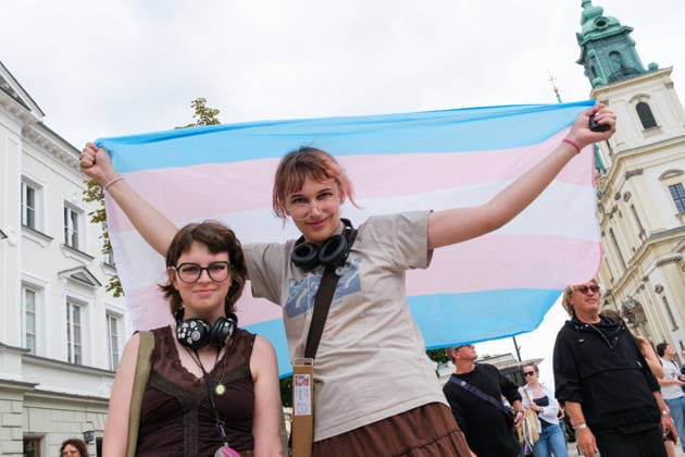 June 13, 2026, Warsaw, Masovian Voivodeship, Poland: A person holds up a trans pride flag up above their shoulders during the 25th annual Warsaw LGBTQ+ Pride Parade, known in Polish as the Equality Parade. LGBTQ+ people in Poland do not have the right to same-sex civil partnerships, marriage, and child adoption, while also facing homophobia and queerphobia from a largely conservative society. Therefore, the parade is organized primarily as a march for equal rights. Warsaw Poland - ZUMAk204 20260613_zip_k204_014 Copyright: xRomanxKozielx