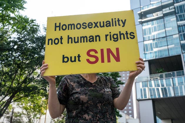 The 27th Seoul Queer Parade (SQP) in Seoul - 13 Jun 2026 A participant against homosexuality holds a placard saying Homosexuality not human rights but SIN during the Seoul Queer Parade. The 27th Seoul Queer Parade (SQP) was held in Seoul, South Korea. It is a public cultural event held downtown every year to promote LGBTQIA+ visibility, human rights, cultural enjoyment, and pride. Seoul South Korea Copyright: xSimonxShinx xSOPAxImagesx _DSC3295