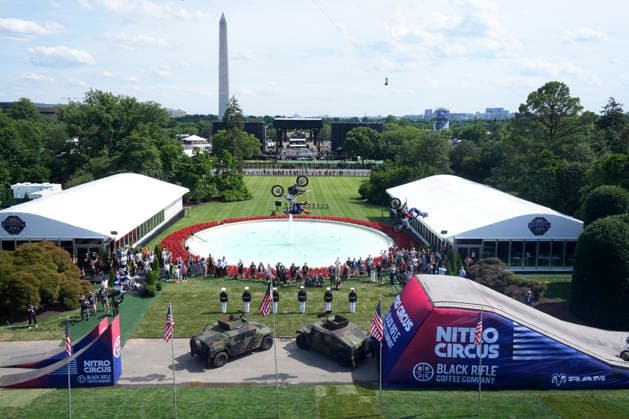 Motor sports athletes and stunt performers do a motorcycle jump ahead of the UFC Freedom 250 fights on the South Lawn of the White House in Washington, DC on Saturday, June 13, 2026.  WASP20260613103 MarkxSchiefelbein