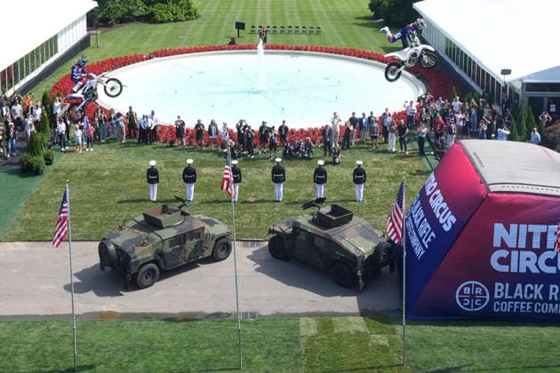 Motor sports athletes and stunt performers do a motorcycle jump ahead of the UFC Freedom 250 fights on the South Lawn of the White House in Washington, DC on Saturday, June 13, 2026.  WASP20260613104 MarkxSchiefelbein