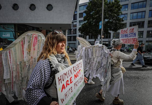 June 13, 2026, Berlin, Berlin, Germany: Thousands of demonstrators gathered in Berlin, Germany, on June 13, 2026, for a mass demonstration in solidarity with Palestinians and to call for an immediate ceasefire in Gaza. Participants marched through the city carrying Palestinian flags, banners, placards, and symbolic installations highlighting civilian casualties, the deaths of journalists, human rights concerns, and the humanitarian situation in Gaza. Protesters demanded an end to the war, increased humanitarian access, accountability for alleged violations of international law, and greater support for Palestinian rights. The demonstration attracted participants from diverse communities and took place under police supervision. Berlin German - ZUMAa268 20260613_zip_a268_016 Copyright: xAbdelrahmanxAlkahloutx