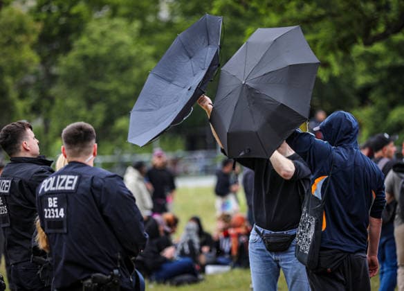 June 13, 2026, Berlin, Berlin, Germany: Demonstrators march through the streets of Berlin, Germany, protesting against the expansion of police surveillance technologies, biometric monitoring systems, facial recognition tools, and the use of artificial intelligence in law enforcement on June 13, 2026. Participants carried banners, flags, umbrellas, and symbolic props, including representations of surveillance cameras, while voicing concerns over privacy rights, state monitoring, and civil liberties. The demonstration was monitored by Berlin police as protesters gathered at several locations across the city demanding greater protections against digital surveillance and data collection. Berlin Germany - ZUMAa268 20260613_zip_a268_013 Copyright: xAbdelrahmanxAlkahloutx