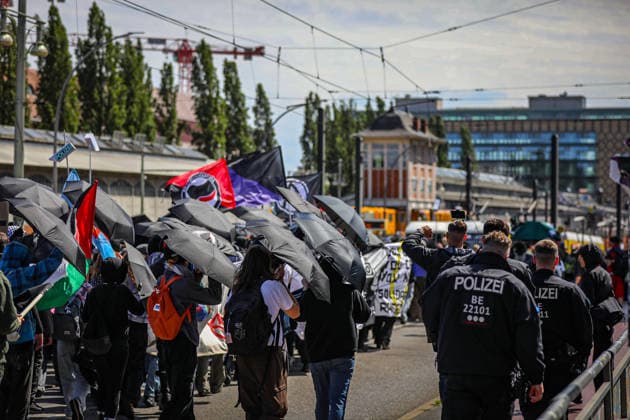 June 13, 2026, Berlin, Berlin, Germany: Demonstrators march through the streets of Berlin, Germany, protesting against the expansion of police surveillance technologies, biometric monitoring systems, facial recognition tools, and the use of artificial intelligence in law enforcement on June 13, 2026. Participants carried banners, flags, umbrellas, and symbolic props, including representations of surveillance cameras, while voicing concerns over privacy rights, state monitoring, and civil liberties. The demonstration was monitored by Berlin police as protesters gathered at several locations across the city demanding greater protections against digital surveillance and data collection. Berlin Germany - ZUMAa268 20260613_zip_a268_008 Copyright: xAbdelrahmanxAlkahloutx