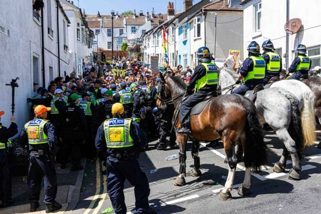 June 13, 2026, Brighton, UK: Brighton, UK. 13 June 2026. Police officers during an anti-immigration protest in the city centre of Brighton. The South East Patriots group hold a march through the centre of Brighton, with about twenty groups under the banner the Carnival Against Fascism organising a counter protest. Police officers kept the two groups apart as tensions were running high. South East Patriots claimed the protest was to demand stronger border control, enforcement of immigration laws, and the deportation of illegal immigrants, with the counter protest groups expressing their resistance against the far right as well as to any form of fascism and racism Brighton UK - ZUMAd99_ 20260613_zap_d99_058 Copyright: xMattxDuckettx