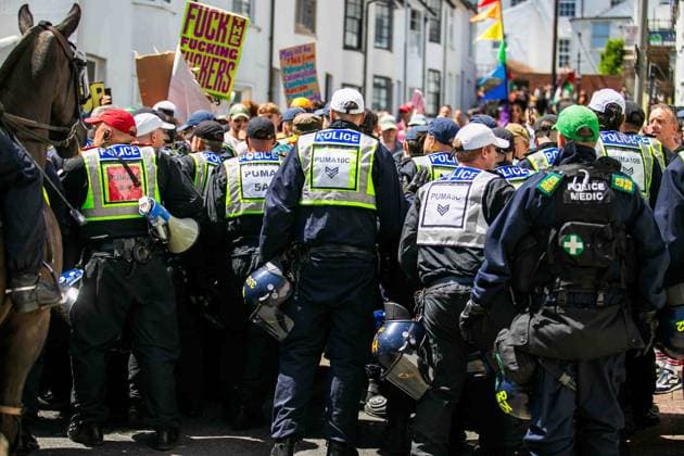 June 13, 2026, Brighton, UK: Brighton, UK. 13 June 2026. Police officers during an anti-immigration protest in the city centre of Brighton. The South East Patriots group hold a march through the centre of Brighton, with about twenty groups under the banner the Carnival Against Fascism organising a counter protest. Police officers kept the two groups apart as tensions were running high. South East Patriots claimed the protest was to demand stronger border control, enforcement of immigration laws, and the deportation of illegal immigrants, with the counter protest groups expressing their resistance against the far right as well as to any form of fascism and racism Brighton UK - ZUMAd99_ 20260613_zap_d99_120 Copyright: xMattxDuckettx