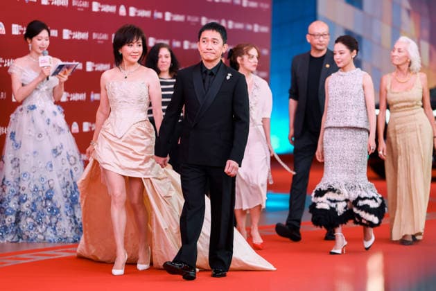 SHANGHAI, CHINA - JUNE 13: Actor Tony Leung Chiu-wai and his wife actress Carina Lau Kar-ling arrive at the red carpet of the 28th Shanghai International Film Festival Gala Night on June 13, 2026 in Shanghai, China.  Copyright: xVCGx 111648017304