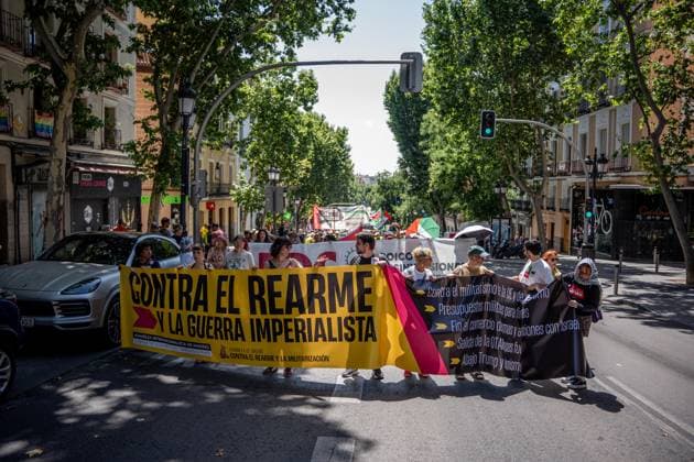 Demonstration in Madrid against rearmament and imperialist war Several people carry a banner with the slogan Against rearmament and imperialist war during a demonstration to protest against rearmament and imperialist war, on June 14, 2026, in Madrid Spain The call is part of the international context of escalating war, In the Spanish state, military spending has increased by 50 percent - the second largest increase in the EU - while the government keeps the Rota and Morón bases active, continues to buy arms from Israel and reinforces its commitment to NATO 14 JUNE 2026 PACIFISM DEMONSTRATION Madrid Madrid Spain  Copyright: xGabrielxLuengasx 7596028