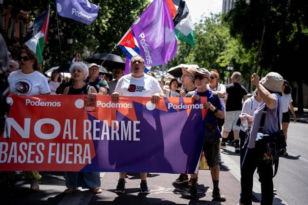Demonstration in Madrid against rearmament and imperialist war Several people carry a banner with the slogan No to rearmament Bases outside during a demonstration to protest against rearmament and imperialist war, on June 14, 2026, in Madrid Spain The call is part of the international context of escalating war, In the Spanish state, military spending has increased by 50 percent - the second largest increase in the EU - while the government keeps the Rota and Morón bases active, continues to buy arms from Israel and reinforces its commitment to NATO 14 JUNE 2026 PACIFISM DEMONSTRATION Madrid Madrid Spain  Copyright: xGabrielxLuengasx 7596035