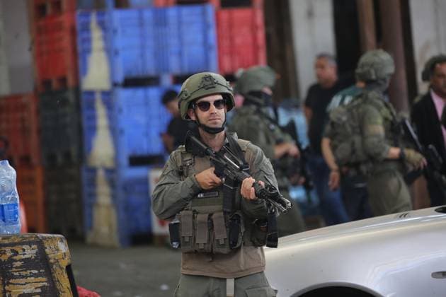 Israeli Forces Conduct Raid in Central Market Area of Nablus NABLUS, WEST BANK JUNE 14, 2026: Israeli soldiers are seen in the central vegetable market area during a military raid in the city of Nablus, in the occupied West Bank. NABLUS Palestine, State of Copyright: x xJNAxEDITORx xJNAxPressx