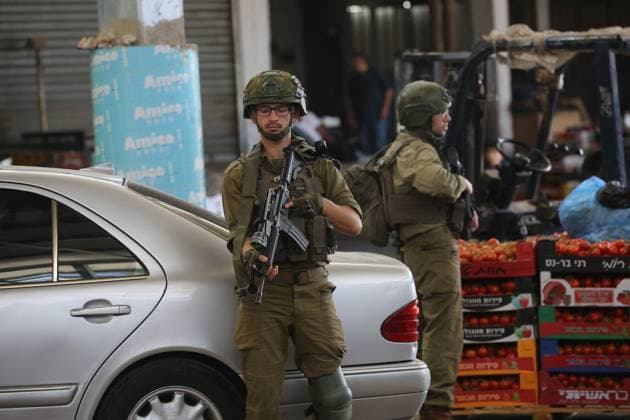 Israeli Forces Conduct Raid in Central Market Area of Nablus NABLUS, WEST BANK JUNE 14, 2026: Israeli soldiers are seen in the central vegetable market area during a military raid in the city of Nablus, in the occupied West Bank. NABLUS Palestine, State of Copyright: x xJNAxEDITORx xJNAxPressx